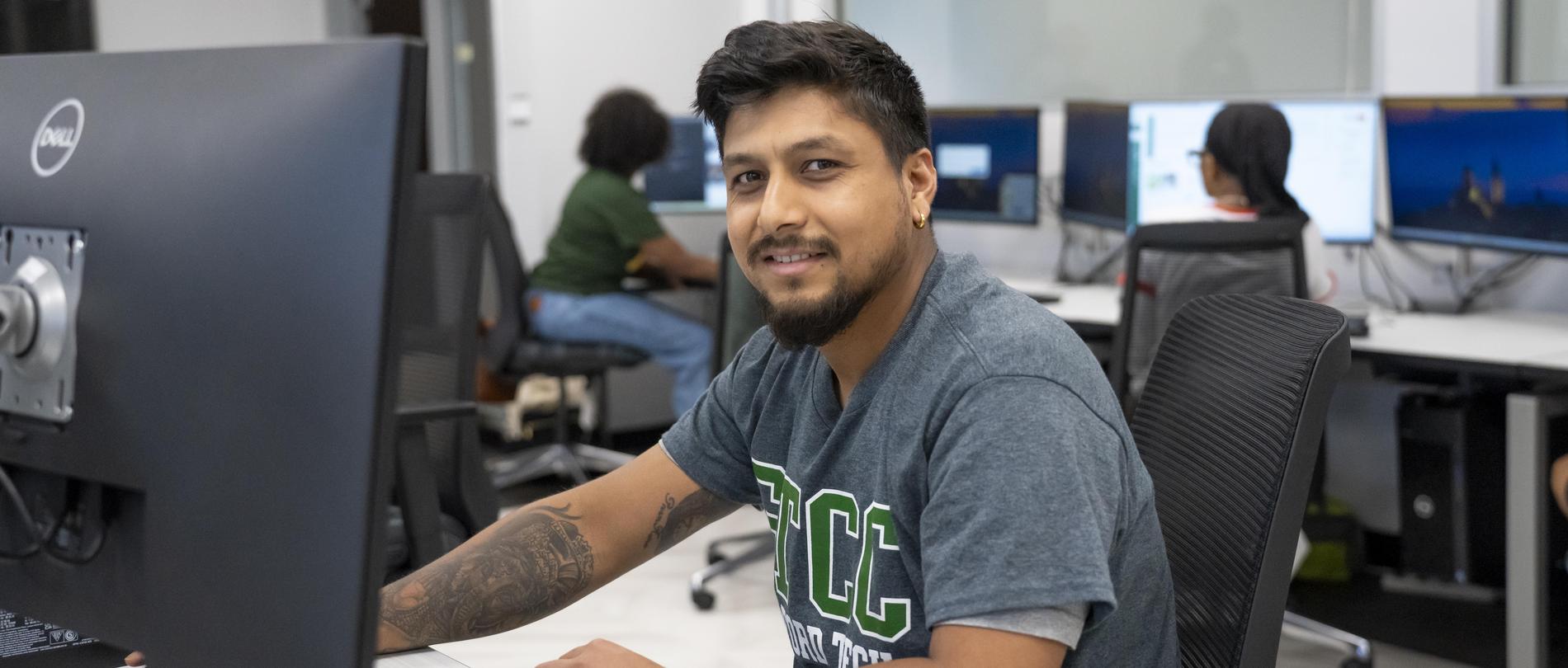 Student sits at a computer