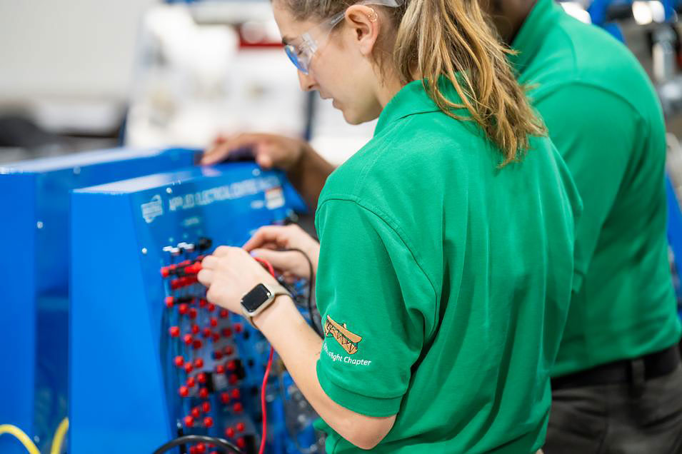 Student Abbey Hayes works on equipment in the lab at GTCC.