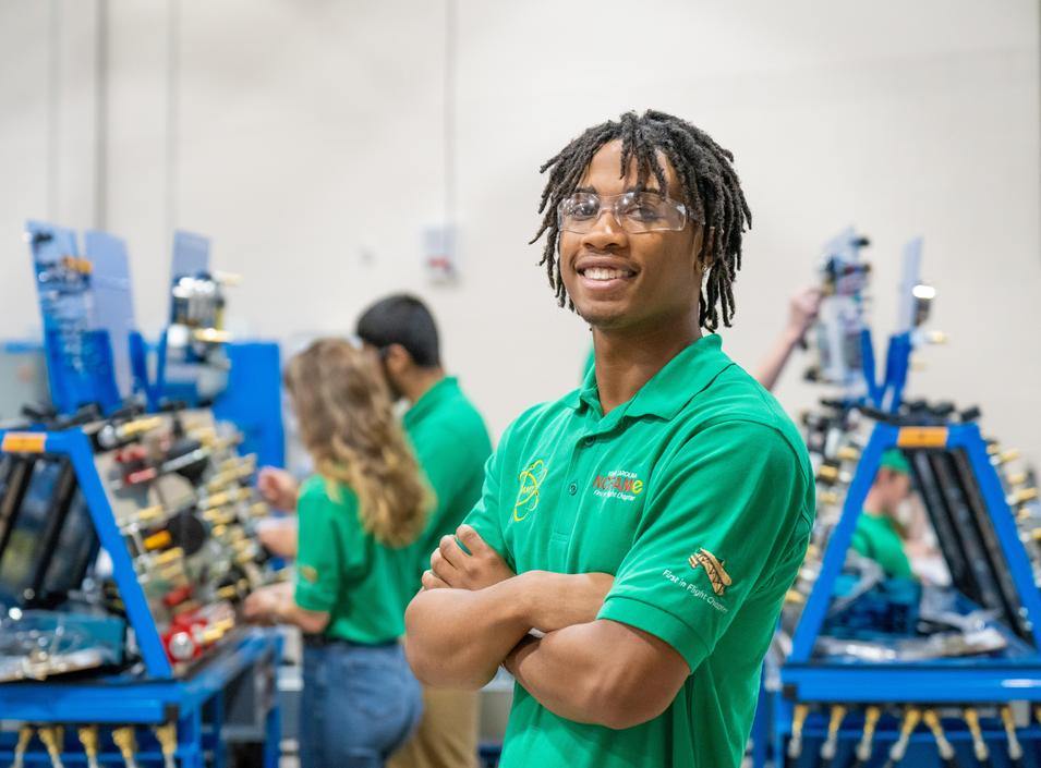 FAME student Darius Headen posses in the temporary FAME lab.